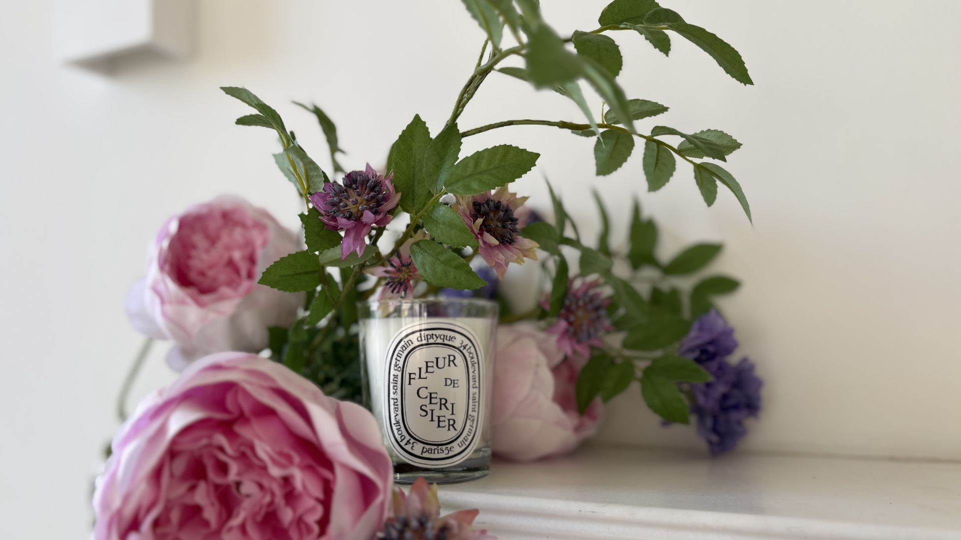 Cherry Blossom Diptyque Candle on a mantlepiece