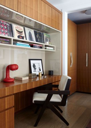 A study with a teak wood built in, vinyl collection and retro lighting