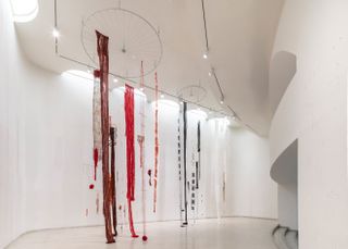Installation view of Cecilia Vicuña, Quipu del Exterminio / Extermination Quipu 2022 Guggenheim new york