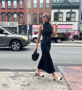Woman wearing a black dress in NYC.