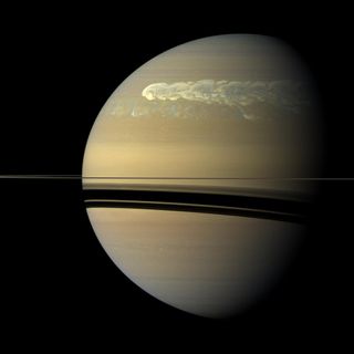 A giant storm passed by its own tail after circling Saturn in this true-color Cassini photo, taken Feb. 25, 2011, about 12 weeks after the storm started. Lightning deep in the planet's atmosphere produced significant radio noise during the storm. The storm formed and dispersed over the course of seven months; researchers said this type of Saturn storm happens only about every 30 Earth years.