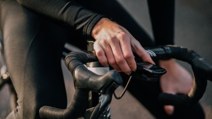 Male rider using a Wahoo cycling computer