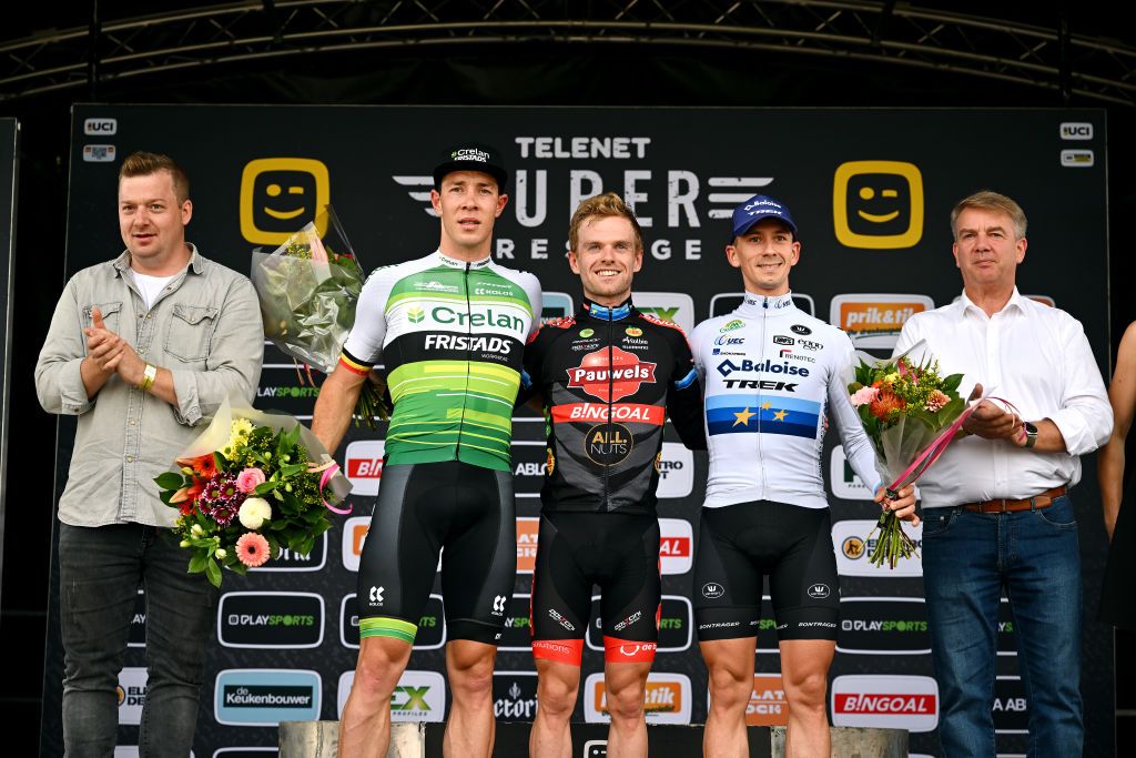 RUDDERVOORDE BELGIUM OCTOBER 29 LR Laurens Sweeck of Belgium and Team CrelanFristads on second place race winner Eli Iserbyt of Belgium and Team Pauwels Sauzen Bingoal and Lars Van Der Haar of The Netherlands and Team Baloise Trek Lionson third place pose on the podium ceremony after the 36th Superprestige Ruddervoorde 2022 Mens Elite SPRuddervoorde Superprestige2023 Cyclocross on October 29 2022 in Ruddervoorde Belgium Photo by Luc ClaessenGetty Images