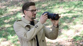 NHS Doctor and Mental Health ambassador Dr Alex George outdoors with his camera