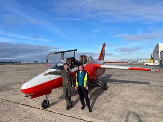 Steve Gale (pilot) and Gail Iles (right) next to the Marchetti jet.