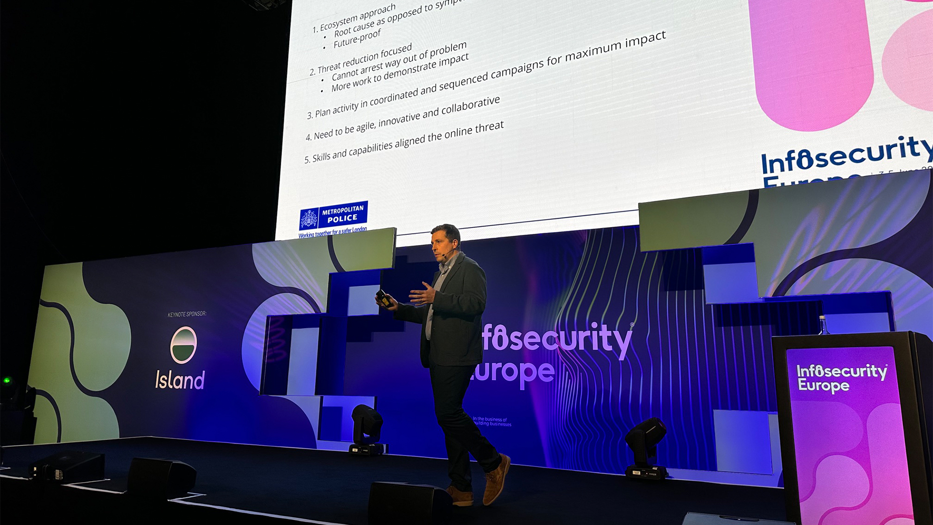 William Lyne, Head of Economic and Cybercrime at the Metropolitan Police Service, speaking on stage during a keynote presentation at Infosecurity Europe 2026 at the ExCel, London.