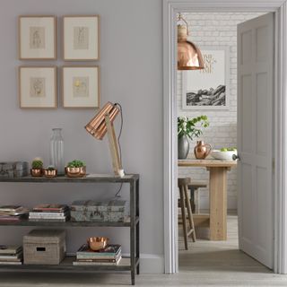 grey hallway with decorative items, metallic table lamp and furnishings