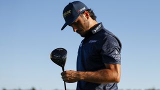 Abraham Ancer of Mexico examines his driver