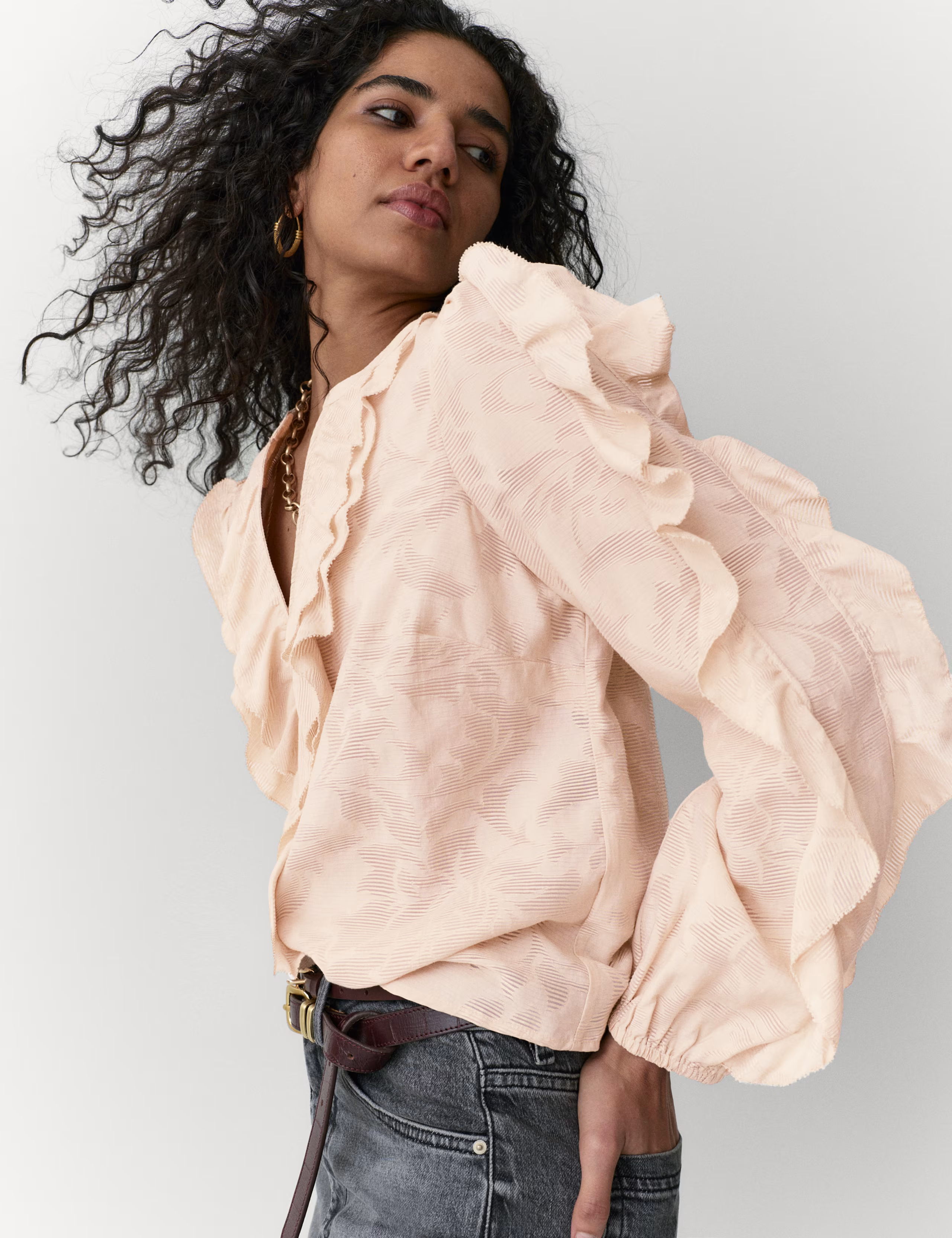 A model wearing a M&amp;amp;S floral blouse.