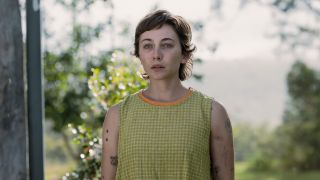 Mavournee Hazel's Blue wearing green-patterned short dress in NCIS: Sydney