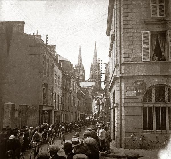 This photo shows the peloton passing through the city of Quimper, with its characteristic cathedral spires, during the 1930 Tour de France. The 210km fourth stage of the Tour started in Brest and finished in Vannes and was won by Omer Taverne (Bel) in a time of 6h56'03". Italian Learco Guerra continued leading the Tour until the ninth stage, when Frenchman Andre Leducq took it in the Queen stage from Pau to Luchon.