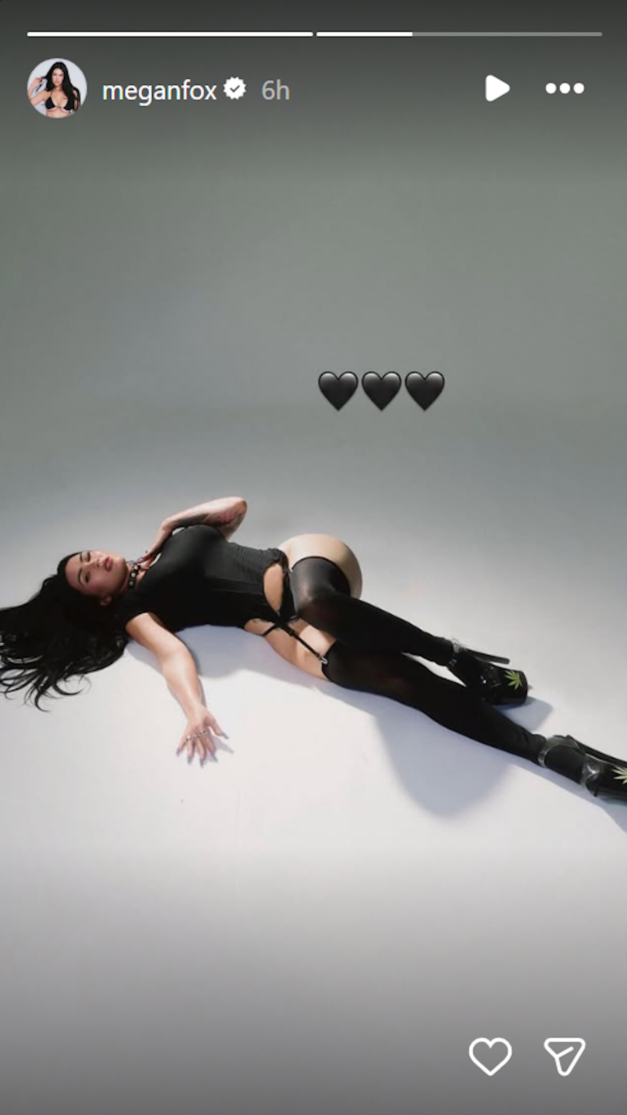 Megan Fox lies on the ground in a black corset as she makes her return to Instagram after over a year.