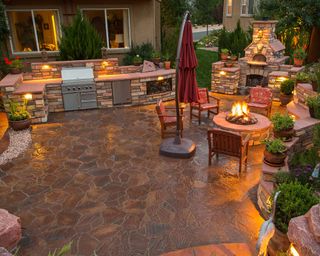 rustic outdoor stone kitchen with pizza oven