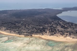 Aerial photo of Nomuka covered in ash following the massive underwater volcano eruption.