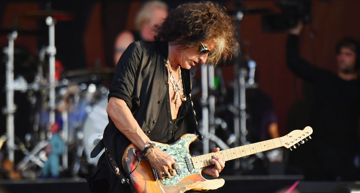 Joe Perry onstage with Aerosmith blind his hybrid S-style with Telecaster headstock