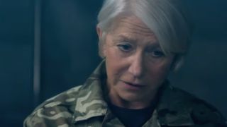 Close up of Helen Mirren wearing camo