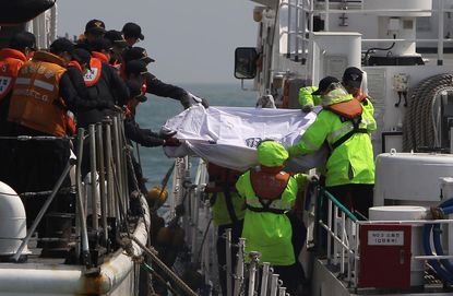 Reports: South Korean ferry was carrying three times more cargo than normal