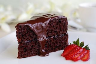 Chocolate cake, with frosting dripping down the sides