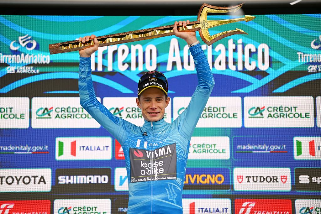 SAN BENEDETTO DEL TRONTO ITALY MARCH 10 Jonas Vingegaard Hansen of Denmark and Team VismaLease A Bike celebrates at podium as race winner and Blue Leader Jersey with Trident Race Trophy during the 59th TirrenoAdriatico 2024 Stage 7 a 154km stage from San Benedetto del Tronto to San Benedetto del Tronto UCIWT on March 10 2024 in San Benedetto del Tronto Italy Photo by Tim de WaeleGetty Images