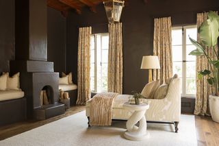 a dark brown painted bedroom in glossy finish