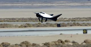Dream Chaser space plane built by Sierra Nevada Corp. landed with its left landing gear undeployed in this still from an Oct. 26, 2013, unmanned drop test at Edwards Air Force Base in California. The malfunction caused the prototype to skid off the runway.