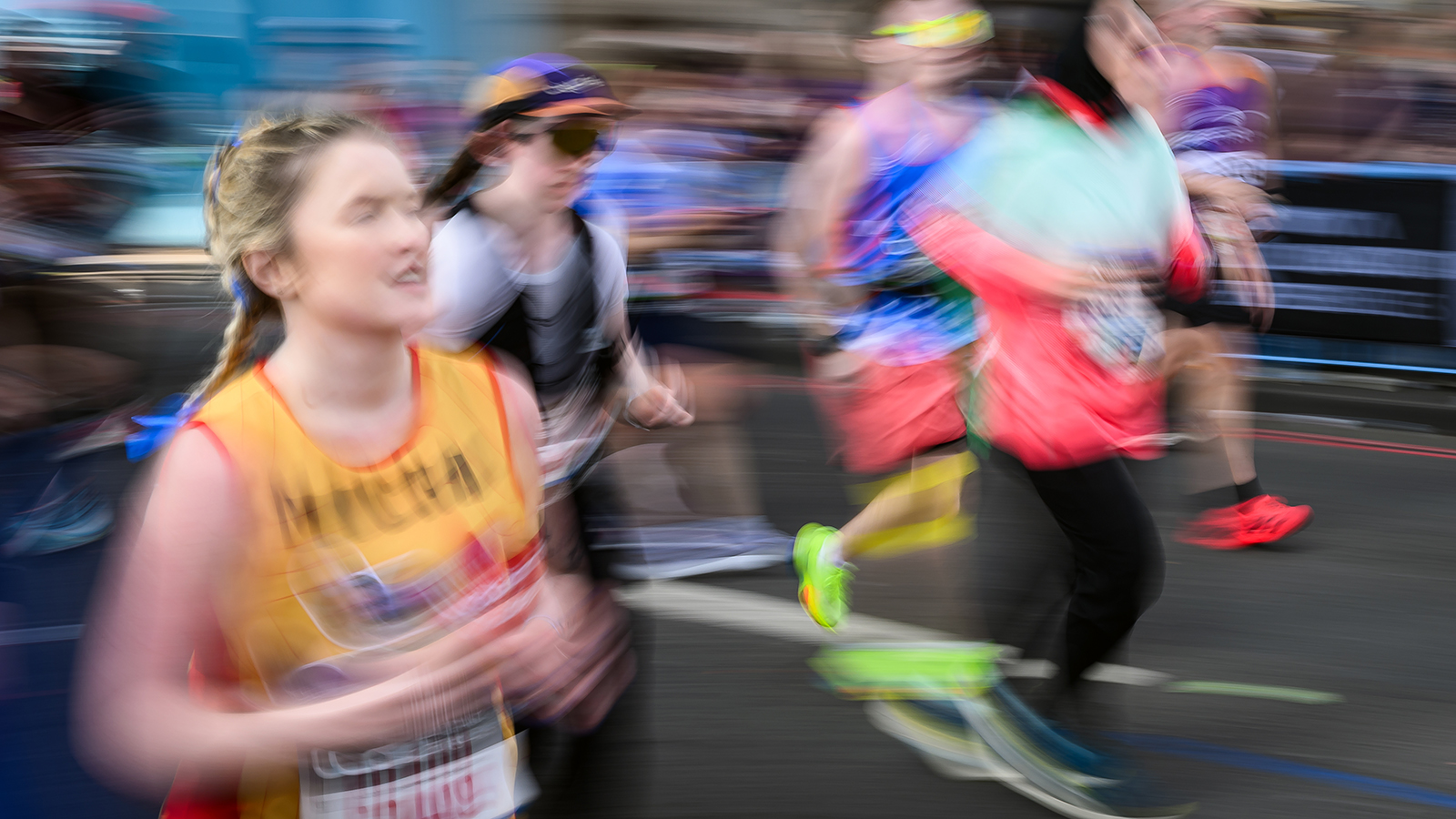 Runners cross Tower Bridge during the London Marathon April 27, 2025 in London, England.