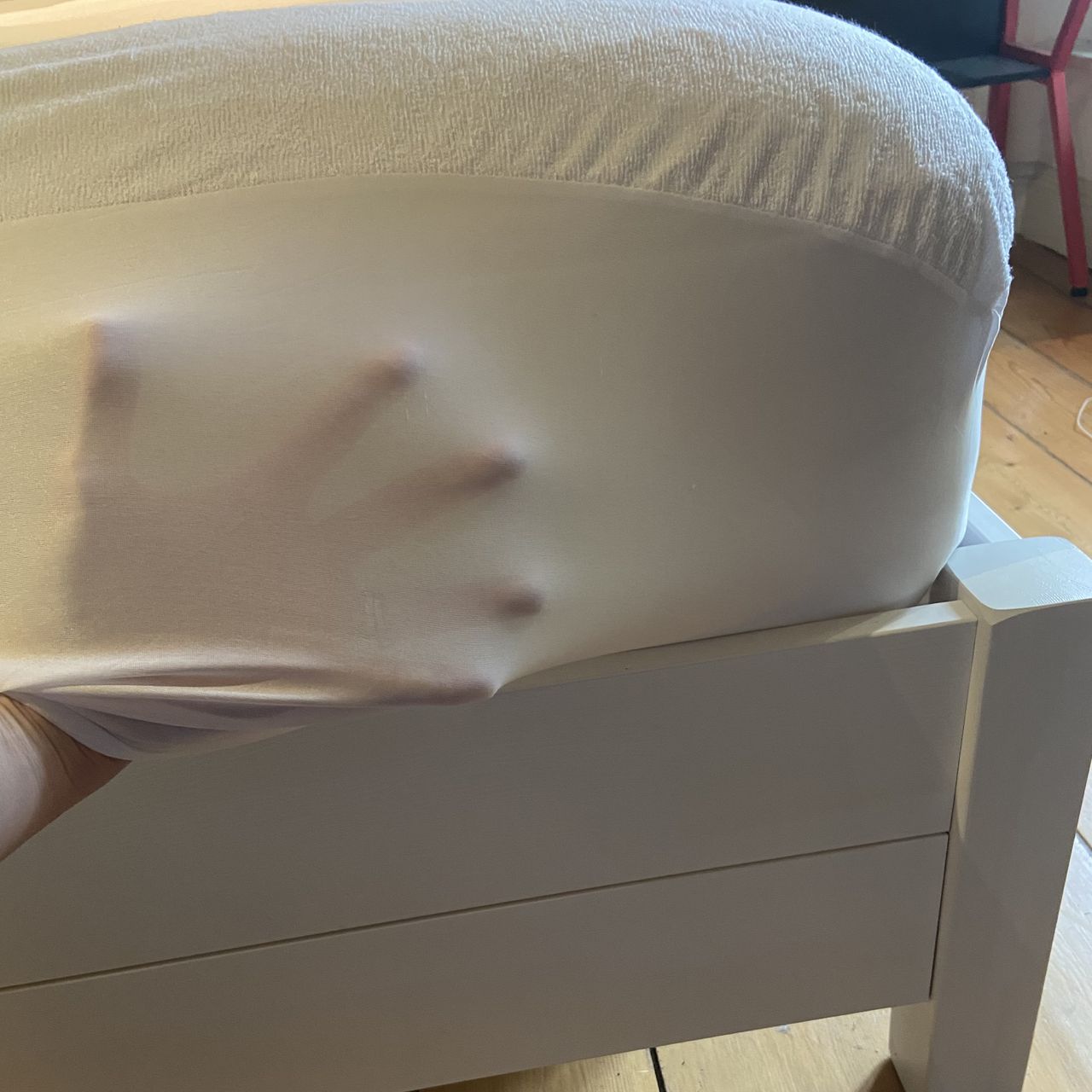 A terry towelling waterproof mattress protector