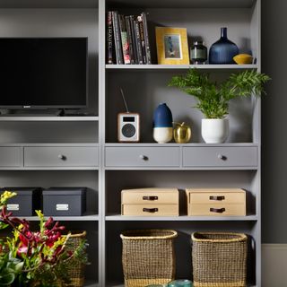 Blue living room storage with boxes