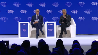 A screenshot from the World Economic Forum showing Larry Fink and Jensen Huang on stage together.