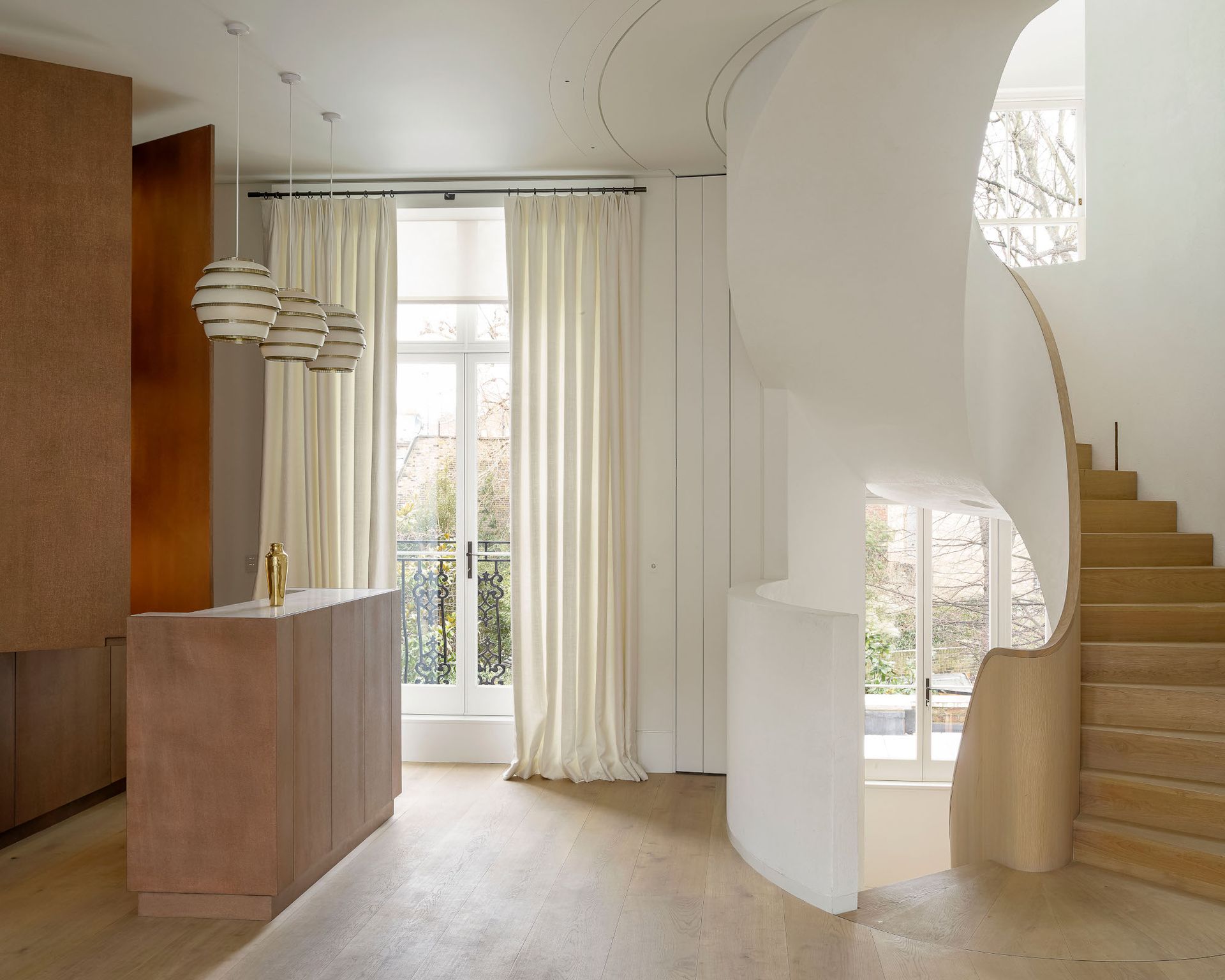 Modern and neutral kitchen design with white walls and wooden surfaces