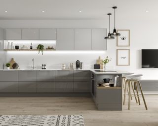 A multi-tonal gloss grey modern grey kitchen with framed wall art and Berber rug