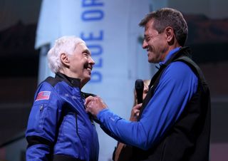 Wally Funk receives astronaut wings from Blue Origin’s Jeff Ashby, a former Space Shuttle commander, after her flight on Blue Origin’s New Shepard into space on July 20, 2021 in Van Horn, Texas.
