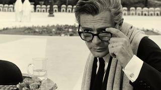 An Italian director peers through his glasses in 8 1/2