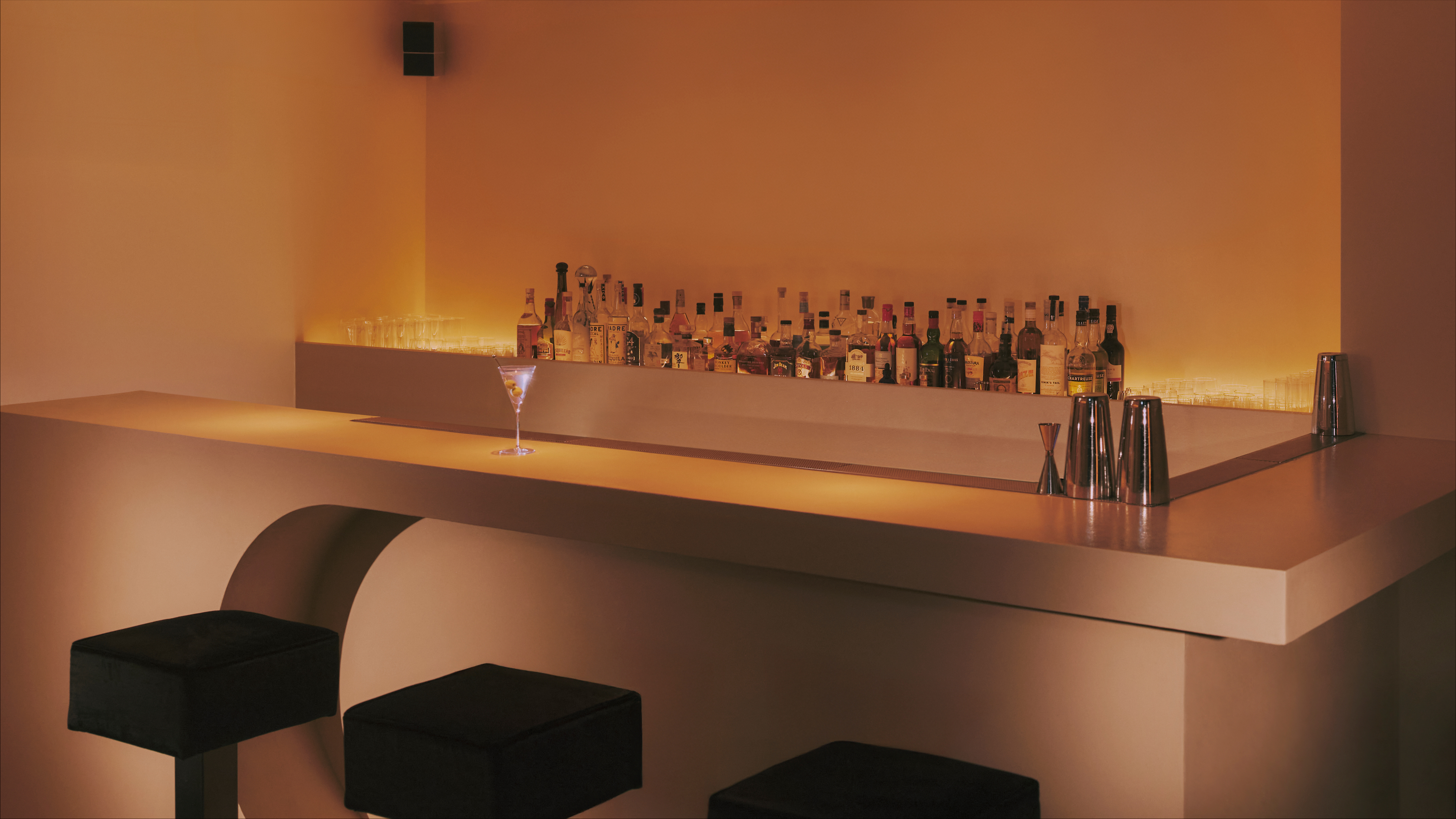 view of an underground bar in london defined by low lighting and velvet textures
