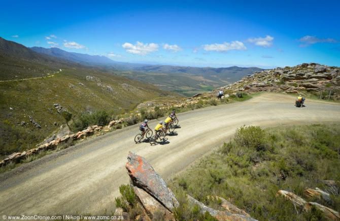 The two leading teams, FedGroup Itec (in yellow) and Asrin Cycling tackle the Swartberg Pass climb to the finish of stage 2