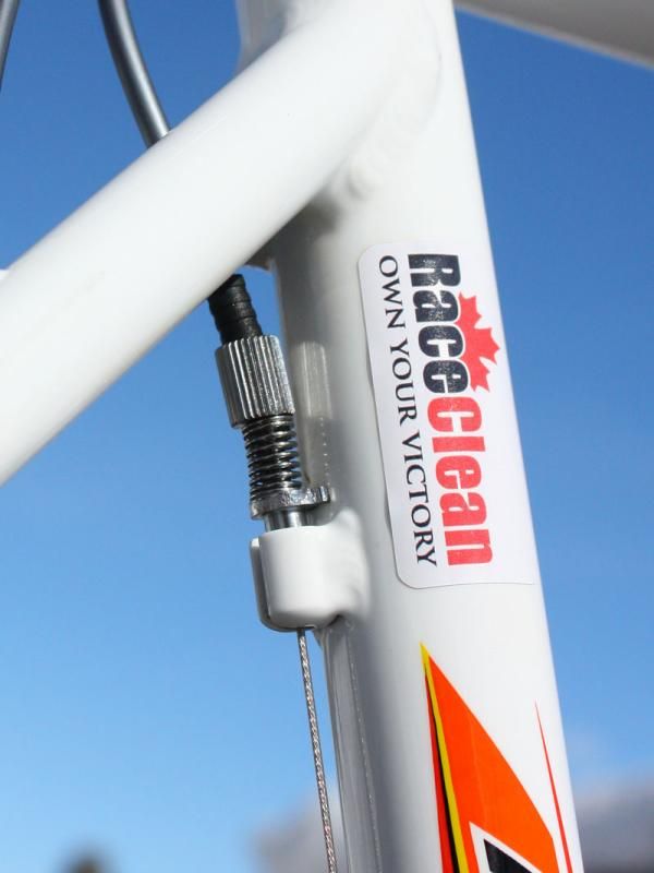 Team mechanic Gary Wolff adds a barrel adjuster to the front derailleur for quick adjustments.