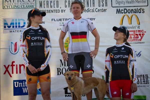 Women's criterium winner Ina Tuetenberg (Specialized) is joined by her dog Sophie on the podium, with Joelle Numainville and Leah Kirchmann in second and third.