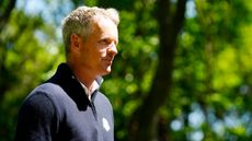 Luke Donald wearing a navy blue Ryder Cup quarter zip