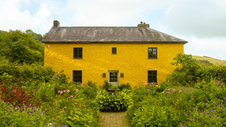 Yellow 18th century farmhouse in Carmarthenshire.