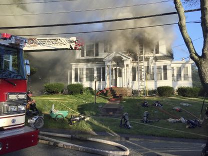 Firefighters battle a blaze in North Andover, Massachusetts.