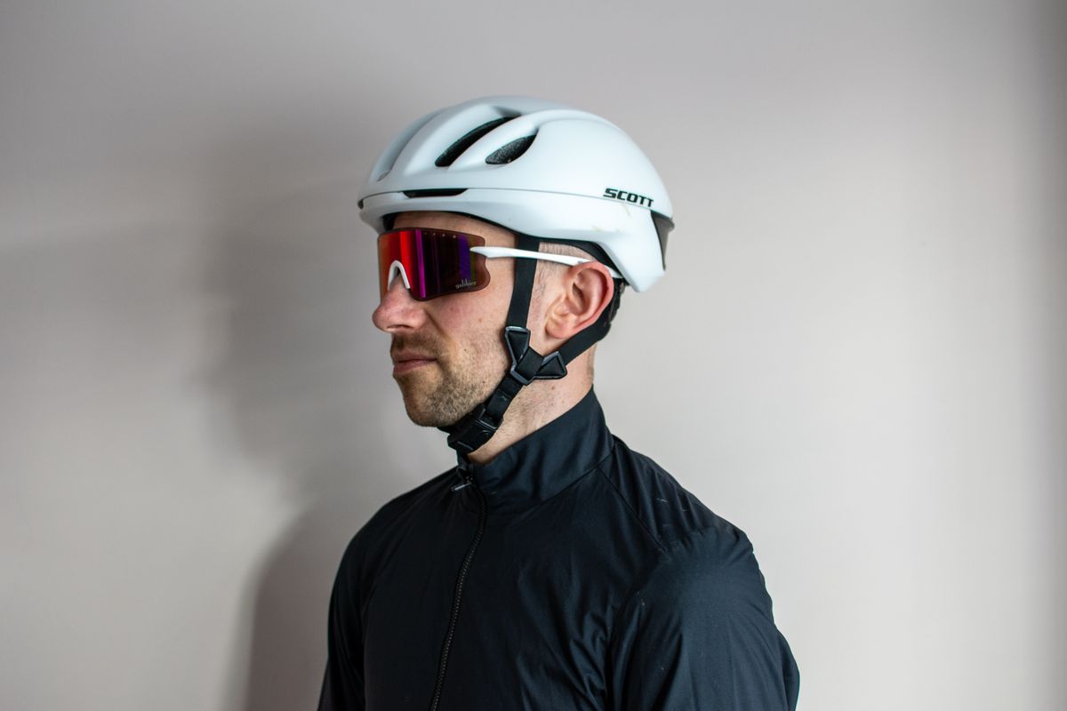 A man wearing a pair of white Galibier Grand Tour sunglases