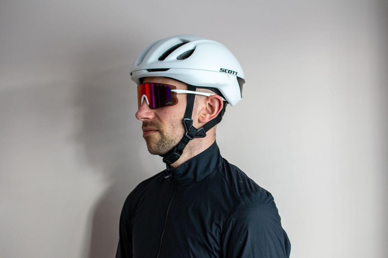 A man wearing a pair of white Galibier Grand Tour sunglases