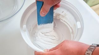 Mixing grout in a bucket
