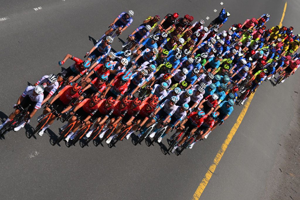 JEBEL JAIS UNITED ARAB EMIRATES FEBRUARY 21 Elia Viviani of Italy and Team INEOS Grenadiers Brandon McNulty of The United States and Team UAE Emirates Red Leader Jersey Tim Merlier of Belgium and Team SoudalQuick Step Green Points Jerseyand a general view of the peloton competing during the 6th UAE Tour 2024 Stage 3 a 176km stage from Al Marjan Island Al Jazirah Al Hamra to Jebel Jais 1489m UCIWT on February 21 2024 in Jebel Jais United Arab Emirates Photo by Tim de WaeleGetty Images