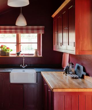 kitchen with red cabinets and walls