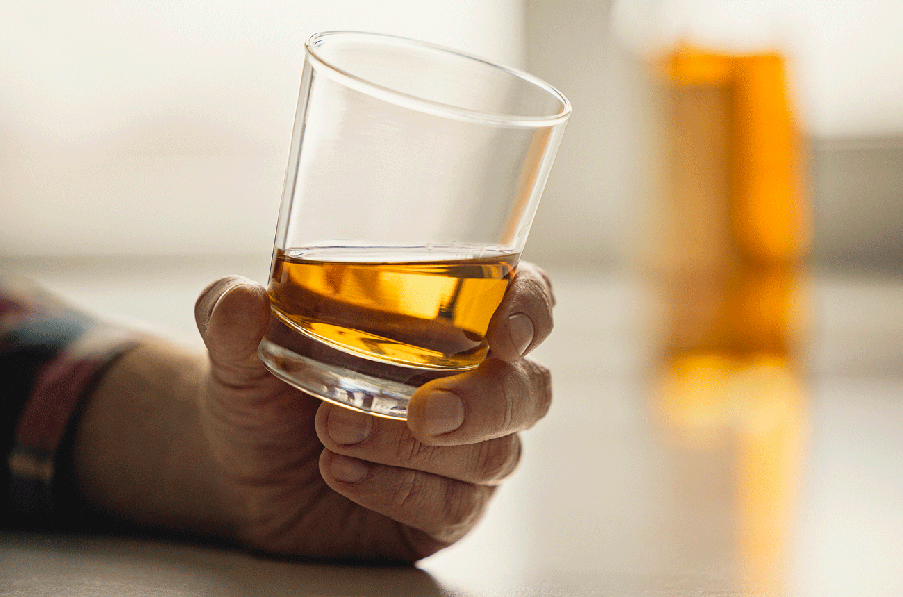 Man holding whisky glass