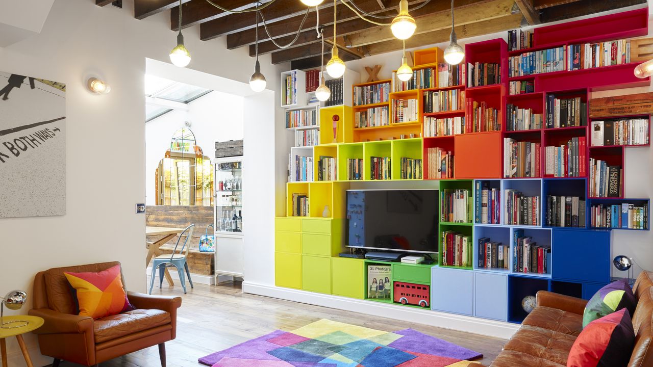 TV stand ideas Colorful living room showing a host of books displayed in the shelves and a TV stand