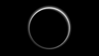The hazy atmosphere of Pluto, backlit by the sun, is seen in this breathtaking farewell photo taken by NASA's New Horizons spacecraft on July 15, 2015 just after its historic flyby of the dwarf planet. Scientists can study the ring-like halo around Pluto to learn more about its atmosphere.
