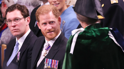 Prince Harry, Duke of Sussex speaks to Princess Anne, Princess Royal during the Coronation of King Charles III and Queen Camilla at Westminster Abbey on May 6, 2023 in London, England. The Coronation of Charles III and his wife, Camilla, as King and Queen of the United Kingdom of Great Britain and Northern Ireland, and the other Commonwealth realms takes place at Westminster Abbey today. Charles acceded to the throne on 8 September 2022, upon the death of his mother, Elizabeth II.