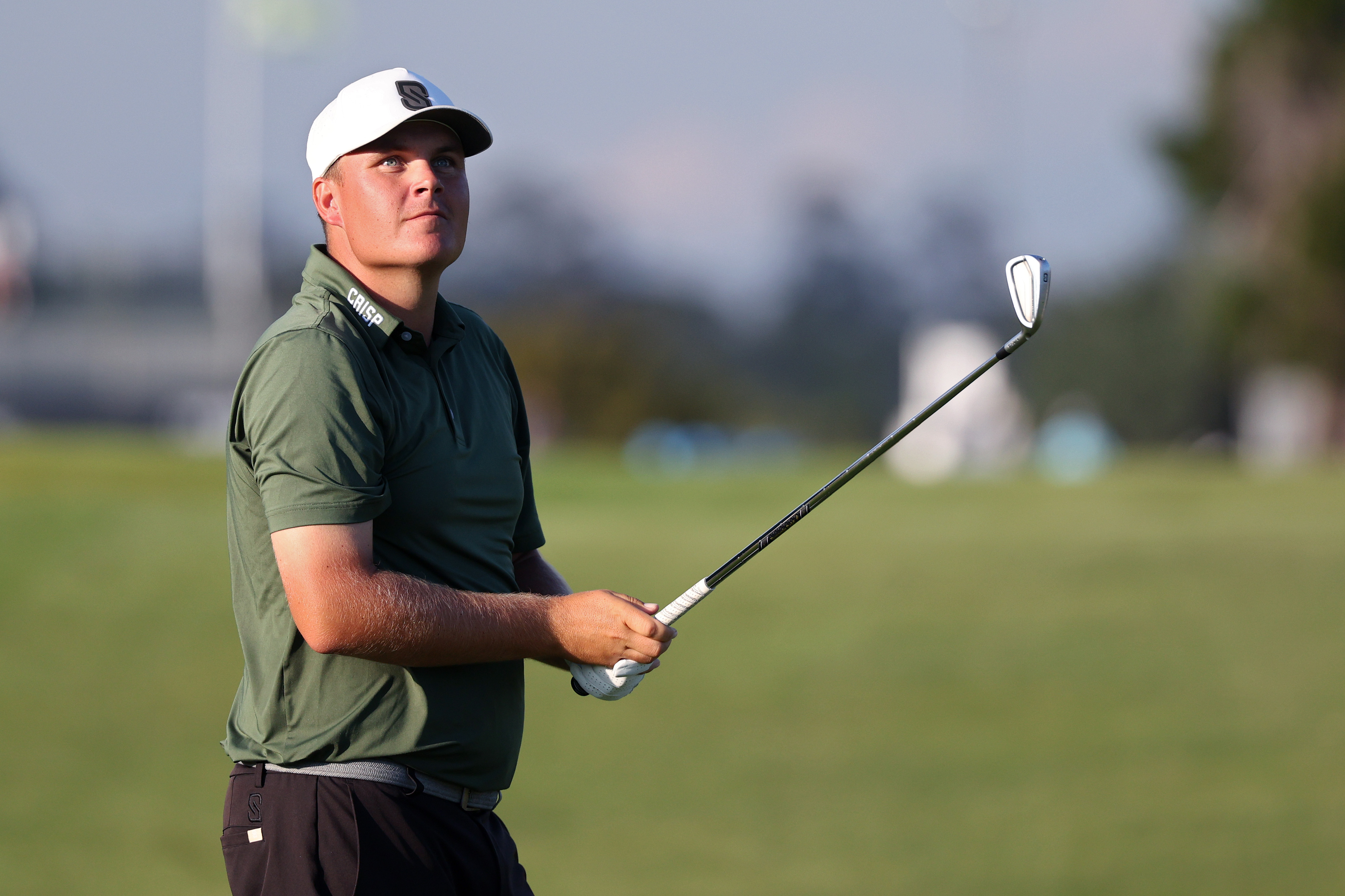 Sami Valimaki hits an iron shot from the fairway